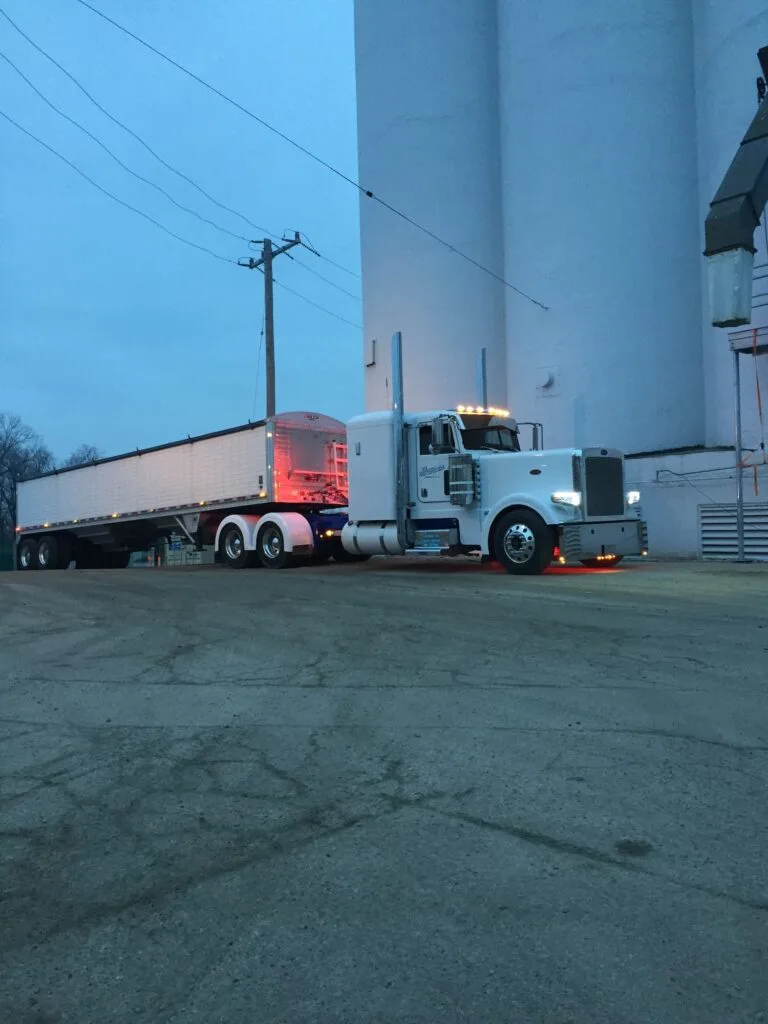 White Hansen truck at dusk