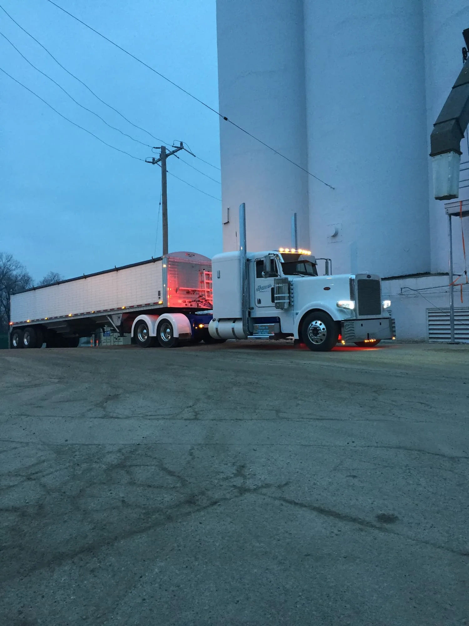 Hansen white truck at dusk