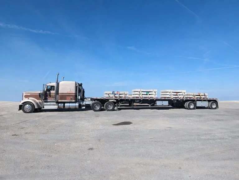 Hansen flatbed with timber load