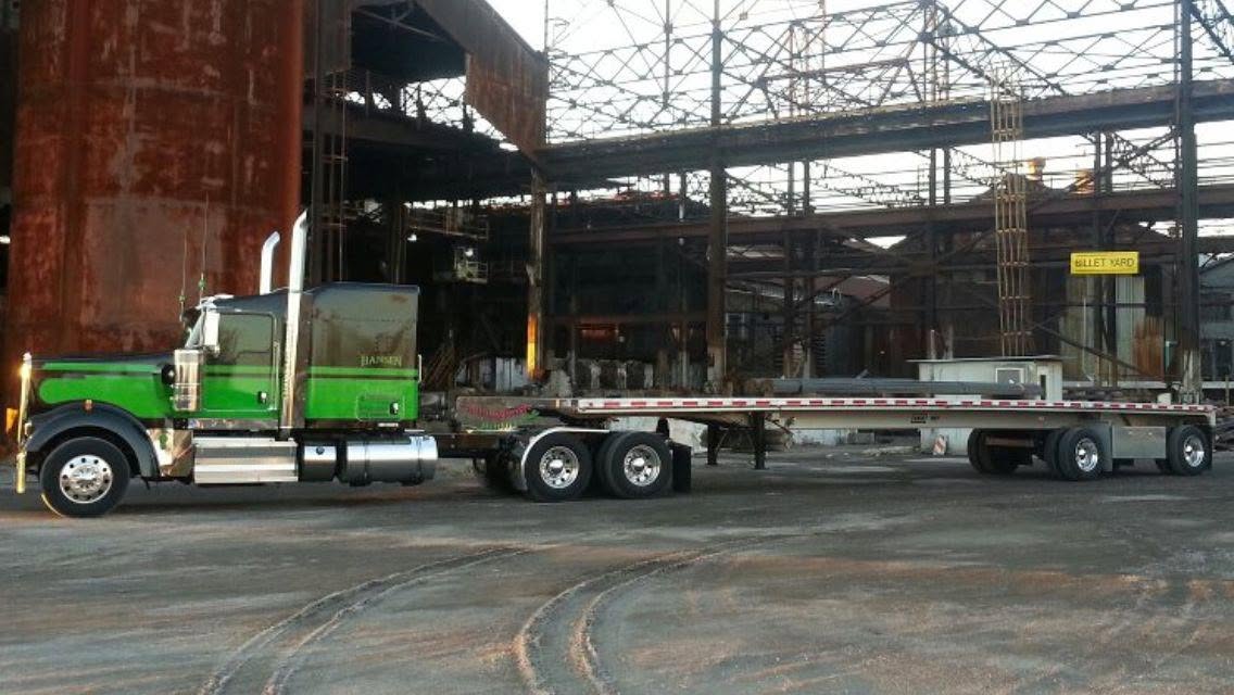 Hansen Trucking green hopper at a grain mill