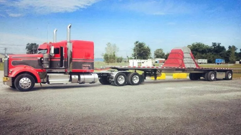 Red Hansen truck with steel coil